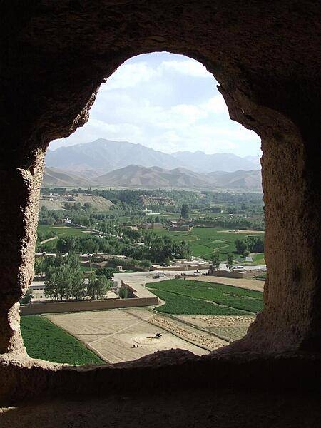 View of surrounding farmlands from within the caves at the "Large Buddha" in Bamyan. The caves were once inhabited by Buddhist monks who left behind a legacy of religious frescoes and paintings, partially destroyed by the fundamentalist Taliban.