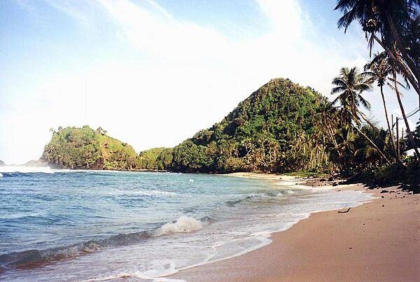 Deserted beach near Pago Pago. American Samoa is an incorporated, self-governing territory of the US. A part of the Samoan island chain, it is the southernmost territory of the US. The large harbor at Pago Pago contains a full US naval station. The inhabitants of American Samoa are American nationals, but not necessarily American citizens.