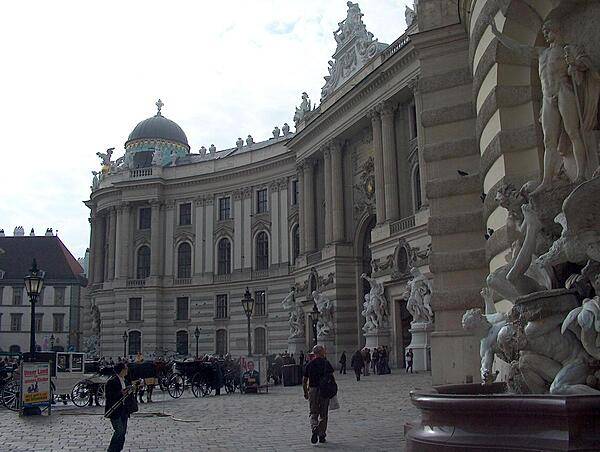 The Michaelertrakt (Michael's Wing) of the Hofburg (Imperial Palace) was designed by the renowned Austrian architect Joseph Emanuel Fischer von Erlach in 1726, but not actually constructed until 1889-1893! The fountain, Power on Land, may be seen on the right.
