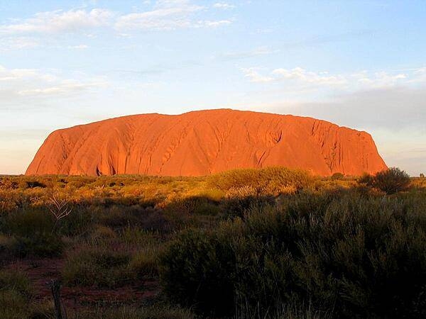 Uluru / Ayers Rock is an inselberg, or island mountain, found in the Northern Territory near Alice Springs - in the middle of Australia's Outback. It is a large sandstone rock formation that the aborigines of the area hold sacred.