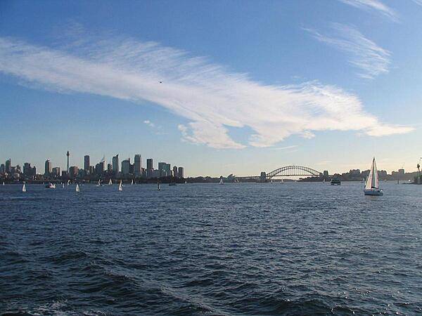 View of Sydney's Harbor and skyline from a boat.