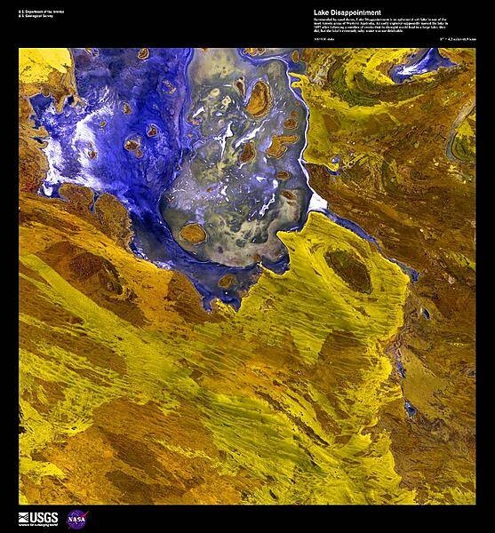 A false-color satellite image of Lake Disappointment, an ephemeral salt lake surrounded by sand dunes in one of the most remote areas of Western Australia. An early explorer supposedly named the lake in 1897 after following a number of creeks that he thought would lead to a large lake; they did, but the lake's extremely salty water was not drinkable. Image courtesy of USGS.