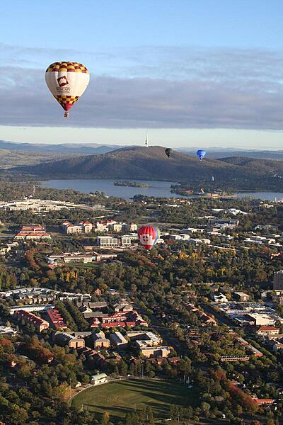 Canberra from the air. This view of Australia's capital includes the Parliament Building, Lake Burley Griffin, and the Black Mountain (telecommunications) Tower.