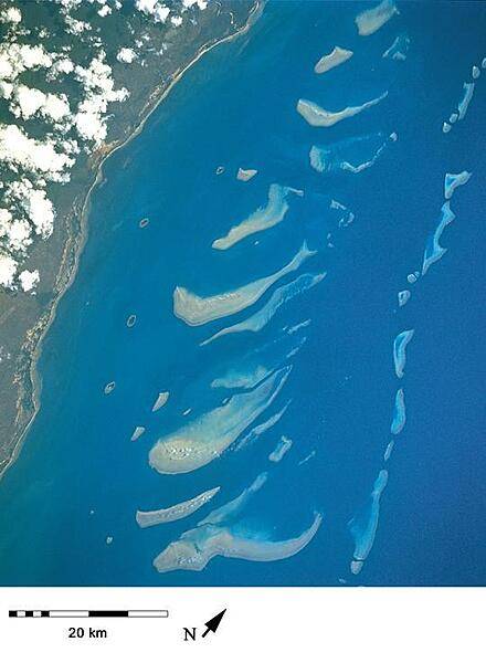 A closer view of some of the northern reefs in the Great Barrier Reef where the continental shelf is relatively narrow and the reefs closer to shore. Image courtesy of NASA.