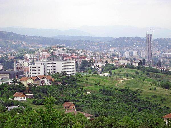 Sarajevo sprawls over much of its namesake valley's floor.