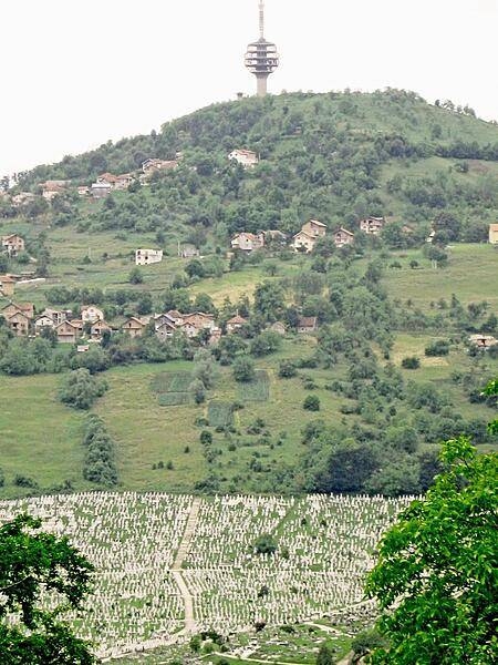 Part of Sarajevo's massive cemetery lies at the base of the hill supporting the city's communication tower.