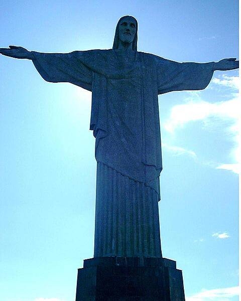 O Cristo Redentor (Christ the Redeemer) statue overlooking Rio de Janeiro. The monument, which is 38 m (120 ft) tall and stands on Corcovado Mountain, is made of reinforced concrete and soapstone. Constructed over a period of nine years, the sculpture was dedicated in 1931. In 2007, it was named one of the New Seven Wonders of the World.