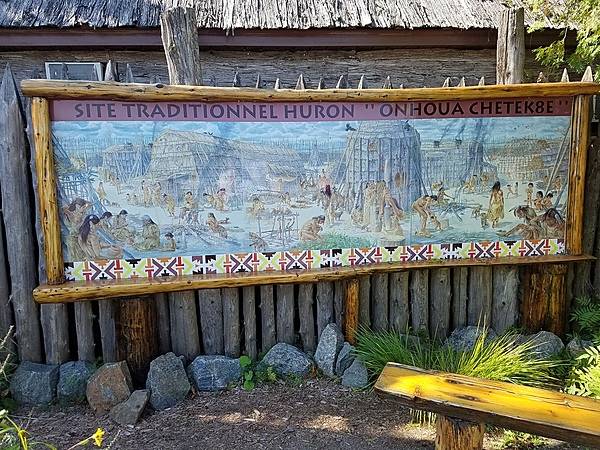 Sign at Wendake, a 300-year-old community established by the Wendat (Huron) people northwest of  Quebec City. The reserve includes a replica Wendat village.