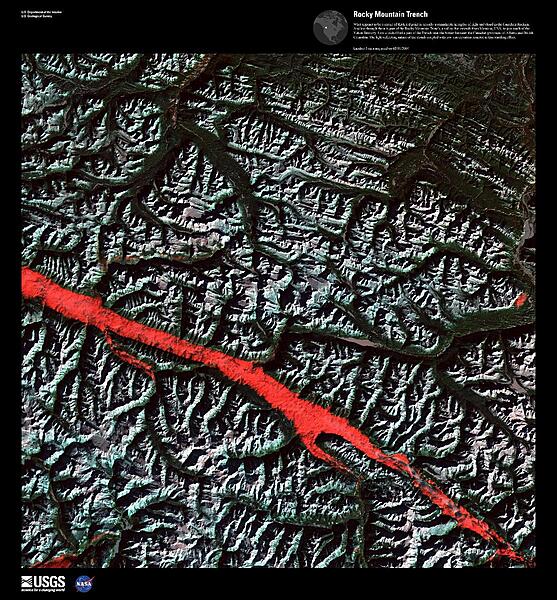 What appears to be a stroke of thick red paint in this false-color satellite image is actually a remarkable interplay of light and cloud in the Canadian Rockies. Angling through the mountains is part of the Rocky Mountain Trench, a valley that extends from Montana in the US, to just south of the Yukon Territory in Canada. Low clouds filled a part of the Trench near the border between the provinces of Alberta and British Columbia. The light-reflecting nature of the clouds coupled with low sun elevation resulted in this startling effect. Image courtesy of USGS.