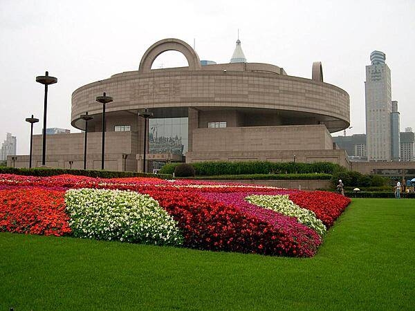 The Shanghai Museum of Ancient Art was founded in 1952 in the club house of the former Shanghai Racecourse. A new building - constructed in the form of an ancient bronze cooking vessel called a ding - was opened in 1996 on People's Square. It houses some 120,000 items including bronzes, ceramics, paintings, calligraphy, furniture, jades, ancient coins, seals, and sculptures.