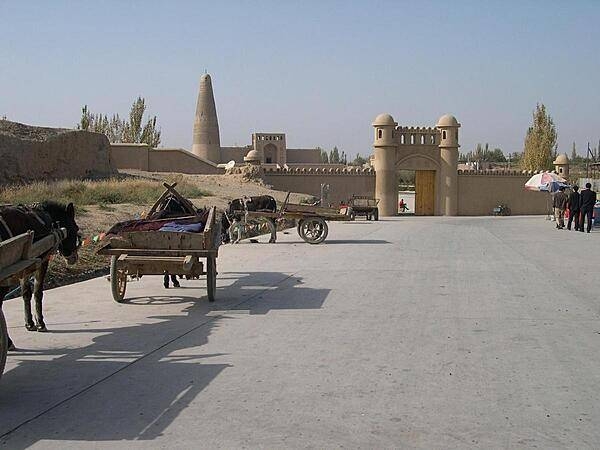 Approaching the Emin Mosque and Minaret in Turpan, an oasis city in Xinjiang Uygur Autonomous Province. The Emin Minaret was begun in 1777 and completed in only one year. It is the tallest minaret in China (44 m, 144 ft) and is named in honor of Emin Khoja, a heroic Turpan general.