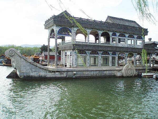 The Marble Boat at the Summer Palace in Beijing. The wooden structure was built in 1755 on a stone base and rebuilt in 1893 as a wooden lakeside pavilion in the shape of a paddle steamer. The structure is faux painted to imitate marble.