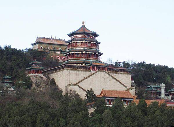 The Tower of Buddhist Incense rises over the Temple of Buddhist Virtue at the Summer Palace in Beijing. The Palace - termed the Gardens of Nurtured Harmony in Chinese - was a summer resort for the imperial family. It consists of palaces, gardens, a lake, and a hill. Gardens have been at the site since the 12th century; construction of the Summer Palace began in 1750.