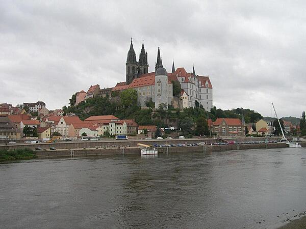 Albrechtsburg Castle and the Meissen Cathedral overlooking the city of Meissen, the "cradle of Saxony" and the capital of the Margraves of Meissen. The castle, designed in late Gothic style, was constructed in the 15th century as a residence. It is now a museum with murals illustrating the history of Saxony Meissen. The Gothic Meissen Cathedral, begun in 1260 on the same hill as the castle, is one of the smallest cathedrals in Europe.