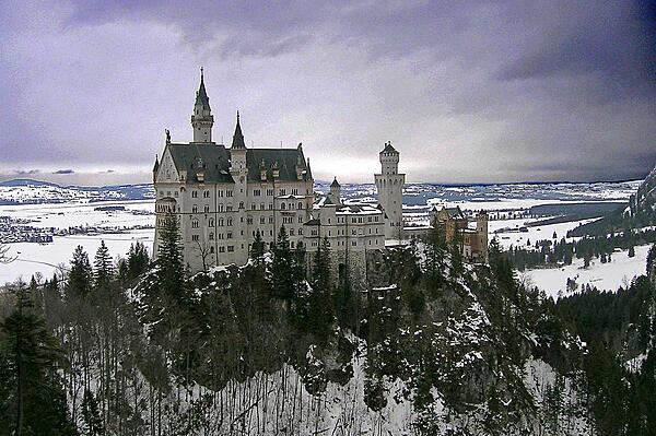 Winter view of Neuschwanstein Castle as seen from the Marienbruecke (Mary's Bridge).  This castle is the best known of the three royal palaces built by King Ludwig II of Bavaria. The design and decoration of the castle pay homage to various medieval legends.