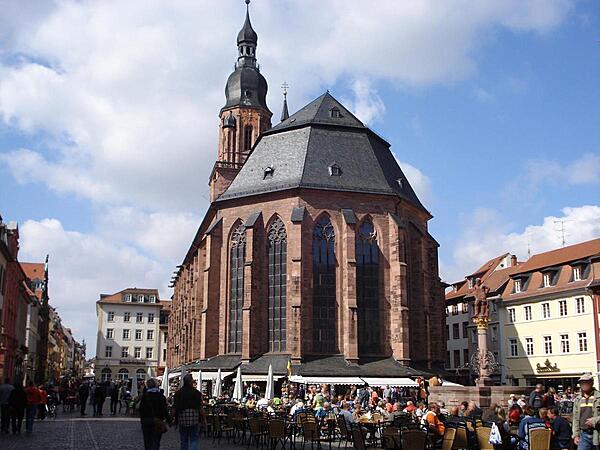 The Heilliggeistkirche (Church of the Holy Spirit) in Heidelberg is first mentioned in 1239. It was the third church to be built on the market place site and it took some 150 years to construct. From about 1706 to 1936 the church was divided by an internal wall that allowed both Catholic and Protestant services to be held within at the same time. In 1936 the wall was removed and the church became exclusively Protestant.