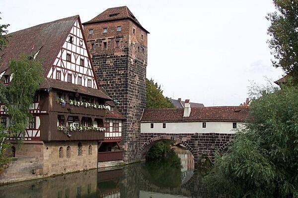 Part of the Hangman's Bridge (Henkersteg; built 1457) in Nuremberg. The city executioner used to live in the tower and the roofed walk above the River Pegnitz. Considered a "persona non grata," the hangman was avoided by the citizens of the city.