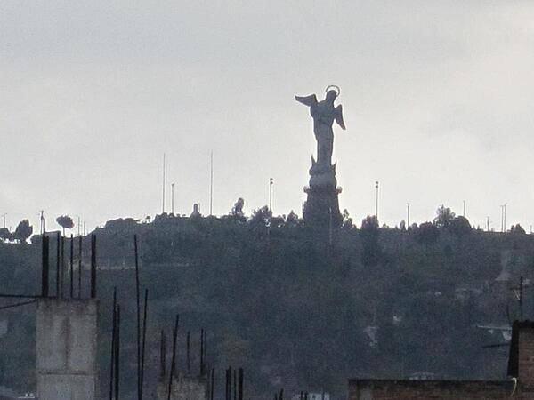 The Virgin of the Apocalypse statue overlooking historic Quito from El Panecillo hill.