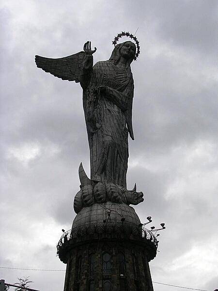 A statue of the "Virgin of the Apocalypse" on El Panecillo (Bread Loaf Hill), overlooking Quito. The 45 m- (148 ft-) tall aluminum statue depicts the Virgin Mary with wings.