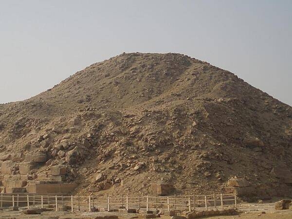 Ruins of the Pyramid of Unis at Saqqara. Much of the stone outer covering was taken to be used in other constructions.