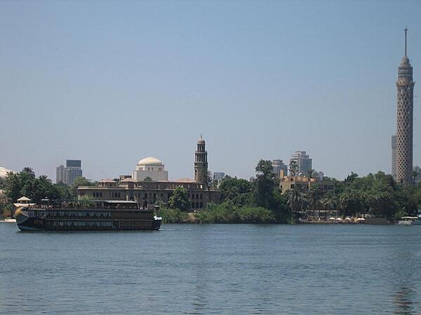Cruising through Cairo on the Nile. The 187 m high Cairo Tower (concrete TV tower) on the far right is 48 m higher than the Great Pyramid at Giza.
