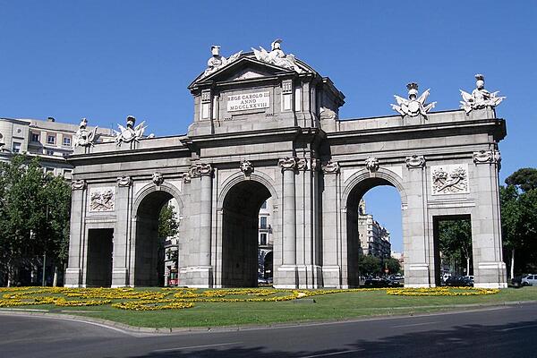 The Puerta de Alcala (Alcala Gate) monument in the Plaza de la Independencia (Independence Square) in Madrid. Inaugurated by King Carlos III in 1778, it originally functioned as an enormous gate in the city's wall.