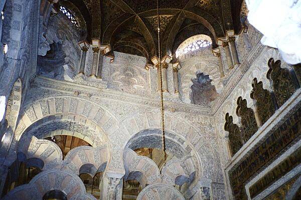 Interior of the Mezquita in Cordoba showing some of the distinctive Muslim architecture and a section of the dome.