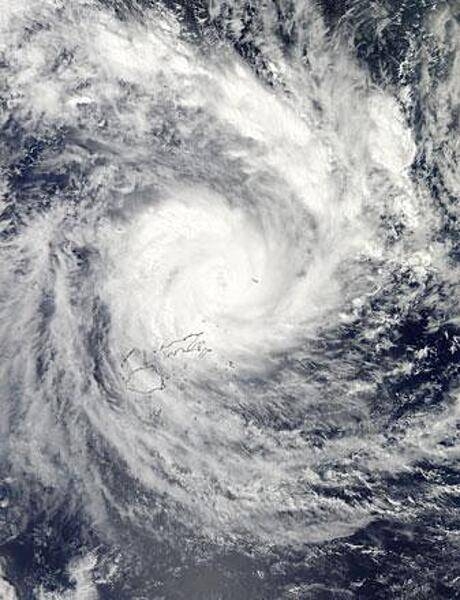 NASA's Aqua satellite passed over Tropical Cyclone Evan on 16 December 2012 and captured this true-color image of the intense storm over the island nation of Fiji. In this image, the storm contains a large, cloud-filled eye, which was estimated at about 17 km (11 mi) across. Heavy rain bands wrap in an apostrophe shape around the center, and reach over the two main islands of Fiji, Viti Levu (south) and Vanua Levu (north). Tropical Cyclone Evan was one of the strongest cyclones to hit Fiji and Samoa in recent memory. In the ten days between first formation on 9 December and dissipation on 19 December, the storm battered Fiji, Western Samoa, American Samoa, Tonga, and Wallis and Futuna. The estimated cost of the storm was $161 million US dollars, and 14 lives were reported lost. Photo courtesy of NASA.