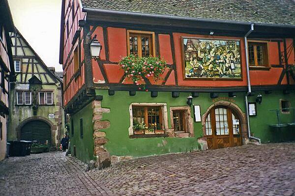 Colorful house in the medieval Alsatian town of Riquewihr. The locale is renowned not only for its historic architecture, but also for the fine wines it produces.