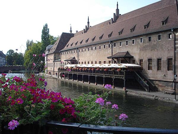 The old custom's building (L'Ancienne Douane) on the Grande Ile in Strasbourg. Constructed in 1358, the structure housed the port and tax authorities, and was used to store and transform goods and merchandise going up and down the Rhine River. Today the building houses a restaurant.