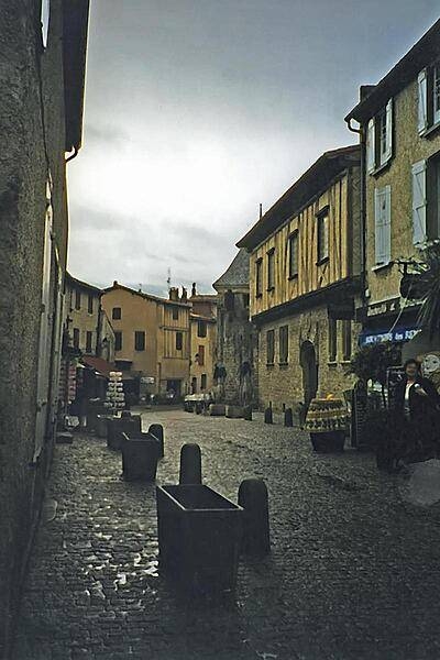 A street scene on a rainy day in the fortified town of Carcassone.