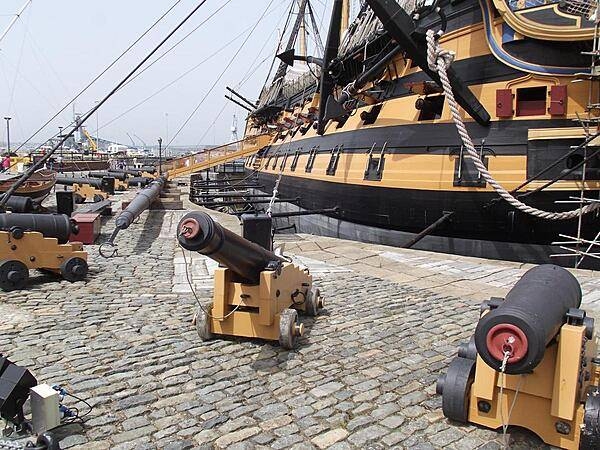 HMS Victory, Lord Nelson's flagship from the Battle of Trafalgar, in drydock at the historic dockyards area of Portsmouth Harbor, England. She is the world's oldest naval ship still in commission and carries 104 guns.