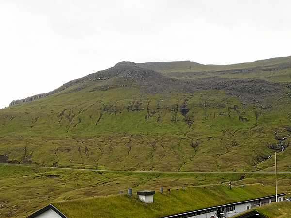 The sod roof on this Shetland house mirrors its grassy setting.