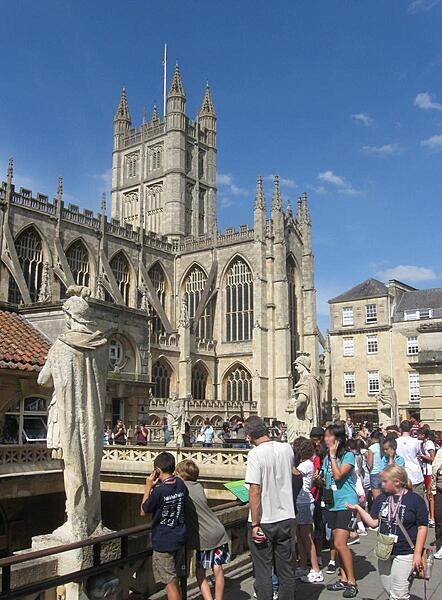 Bath Abbey stands nearby the Roman Baths in Bath, England.