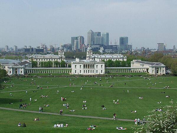 The Queen's House, Greenwich viewed from Observatory Hill. Shown are the original house (1635) and the wings linked by colonnades (1807). Beyond the House is the Old Royal Naval College, completed in 1712.