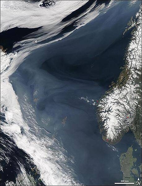 Grayish white over the deep blue Norwegian Sea, a thick cloud of  smoke drifts north off the western coast of Norway in this image, taken on 7 May 2006, by NASA's Aqua satellite. The smoke is coming from hundreds of fires burning in western Russia, most of which are probably agricultural fires. By the time this image was taken, smoke had lingered over the Norwegian Sea for more than a week as the fires continued to burn. In this image, hazy skies extend from Denmark, lower right, west to Iceland, upper left. The densest of the smoke hangs over the Shetland Islands (lower center) and the Faroe Islands (left center). The northern shores of Great Britain are in the lower left corner of the image. Photo courtesy of NASA.