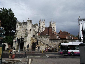Much of York's ancient walls still survive; they are punctuated by four main gatehouses (referred to as "bars"). Bootham Bar has some of the oldest surviving stonework - dating to the 11th century A.D. It was built almost exactly on the site of the northwestern gate of Eboracum, the Roman settlement that evolved into York. This view, taken from Exhibition Square, shows York Minster, the city's famous cathedral, in the background.