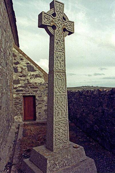 Celtic cross outside of St. Moluag's Church - Teampull Mholuaidh in Scots Gaelic - in the town of Eoropie on the Isle of Lewis in the Outer Hebrides of northern Scotland.