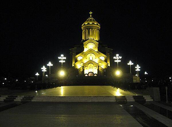 The Sameba (Holy Trinity) Cathedral in Tbilisi, is the main Georgian Orthodox Christian cathedral. It was built between 1995 and 2004 as a symbol of Georgian national and spiritual revival. The cathedral, located on the left bank of the Mtkvari River in Old Tbilisi, is cruciform and contains nine chapels. The Sameba complex also includes various other religious buildings.