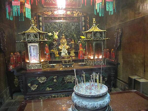 The Man Mo Temple in Tai Po, Hong Kong. The incense-filled temple, dedicated to Man (literature) and Mo (military), was built in 1893 in the style of a central walled compound to emphasize seclusion.