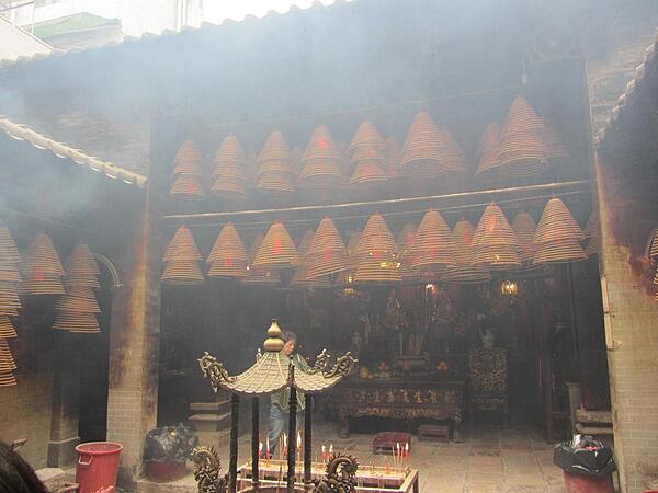 The Man Mo Temple in Tai Po, Hong Kong is 26 km (16 mi) from the harbor. The incense-filled temple is dedicated to Man (literature) and Mo (military). It was built in 1893 in the style of a central walled compound to emphasize seclusion.