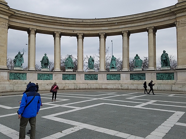 The statues of kings and military leaders in the left colonnade of the Millennium Monument in Budapest.