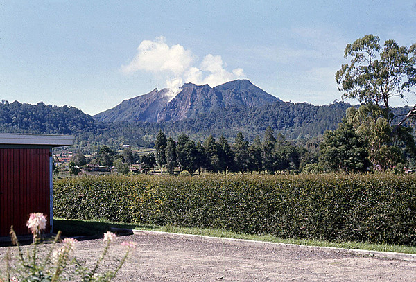 Indonesia is tectonically highly unstable, making it the site of numerous volcanoes and frequent earthquakes. The archipelago lies on the Pacific Ring of Fire where the Indo-Australian Plate and the Pacific Plate are pushed under the Eurasian plate and where they melt at about 100 km (62 mi) below the earths' surface. A string of volcanoes runs southeastward through Sumatra, Java, Bali, and Nusa Tenggara, and then fishhooks north and westward to the Banda Islands of Maluku and North Sulawesi. Indonesia has about 150 active volcanoes, the most of any country on earth. The photo shows a dormant but smoking volcano on the island of Sumatra.