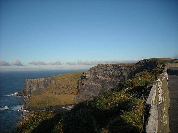 The Cliffs of Moher in County Clare range from 120 m (394 ft) at Hag's Head to their maximum height of 214 m (702 ft) above the Atlantic Ocean just north of O'Brien's Tower. Comprised of mainly shale and sandstone, the cliffs are home to large colonies of Atlantic Puffins.