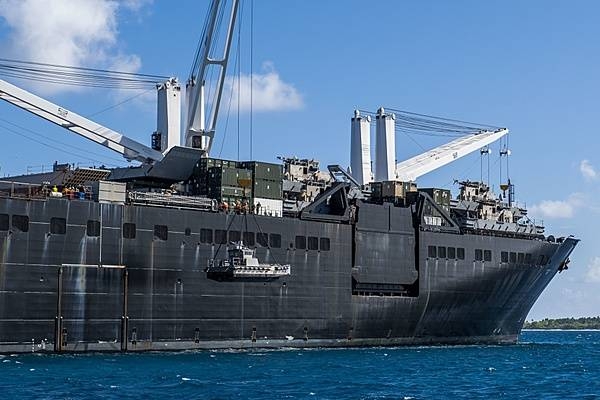 The USNS Seay (T-AKR 302), a Military Sealift Command roll-on roll-off vehicle cargo ship, at anchor in the lagoon at Diego Garcia. The photo shows sailors lowering a maritime prepositioning force utility boat from the USNS Seay using a crane during a ship-to-shore logistics training exercise. Diego Garcia provides critical logistical infrastructure support to US and Allied Forces forward deployed to the Indian Ocean and Arabian Gulf. Photo courtesy of the US Navy/ Mass Communication Specialist 1st Class Nathan Carpenter.