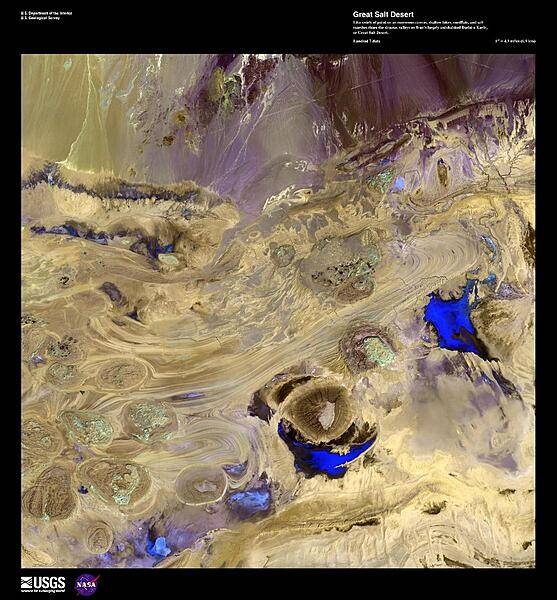 In this enhanced false-color satellite photo, shallow lakes, mudflats, and salt marshes share the sinuous valleys on Iran's largely uninhabited Dasht-e Kavir, or Great Salt Desert. Due to the high heat and arid climate, marshes, lakes, and wadis experience an extreme rate of groundwater evaporation leaving large crusts of salt. Image courtesy of USGS.
