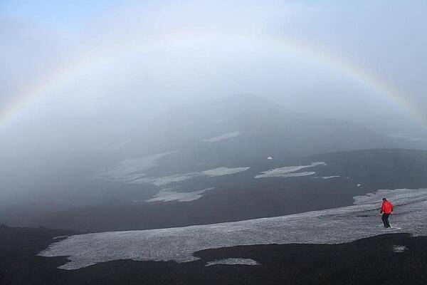 Descent down Hekla across the snowpack. Hekla is a stratovolcano located in the south of Iceland; it is one of the island's most active volcanoes, having erupted more than 20 times since the ninth century A.D.
