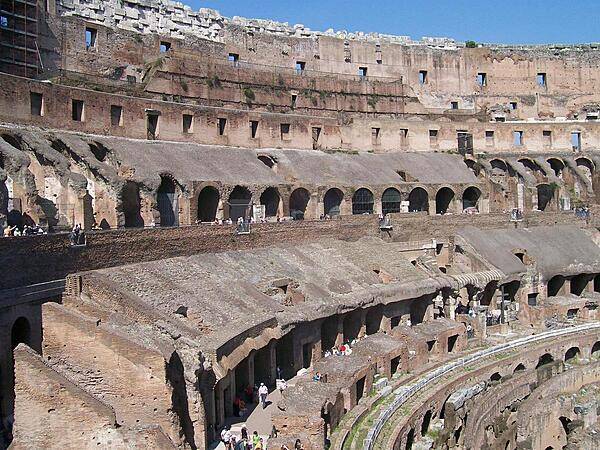 The Colosseum in Rome, the largest ever built in the Roman Empire, could seat 50,000 (some estimates go as high as 80,000). Begun in A.D. 72 and completed in A.D. 80, it accommodated gladiatorial contests, games, and spectacles. This is a view of its ruins from the inside.
