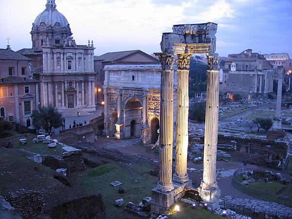 Evening at the Forum in Rome. Note the Colosseum in the distance.