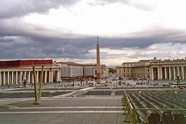 Looking past the obelisk that stands at the center of St. Peter's Square in the Vatican out to the city of Rome.